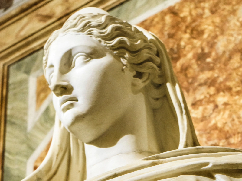 old sculpture of woman